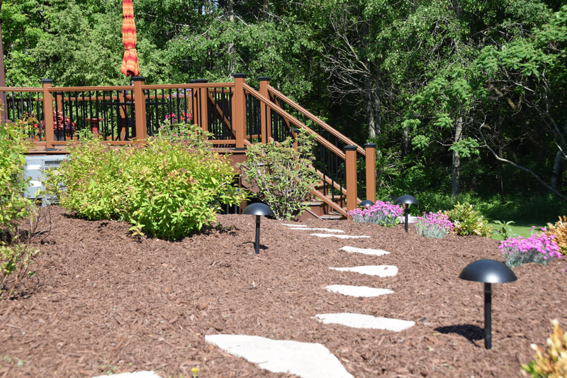 Mulch and flower bed with annuals and perennials